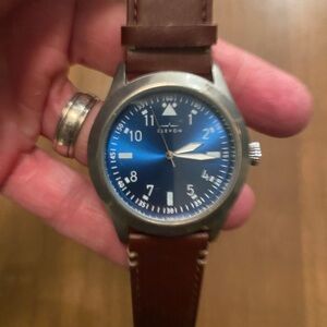 Elevon Hanson genuine leather watch with a blue dial and brown strap.